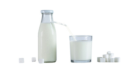 A bottle and a glass filled with milk next to small white objects on a white surface, studio shot isolated on white