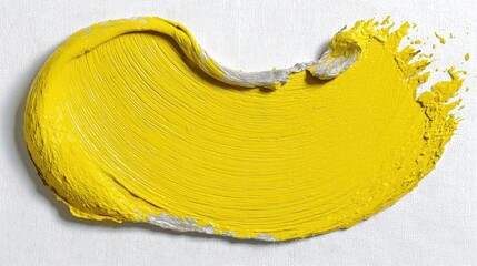 Dynamic Yellow Paint Swirl on Rough White Canvas Surface Under Bright Studio Lights Showcasing Artistic Texture and Bold Abstract Design for Creative Visual Effects