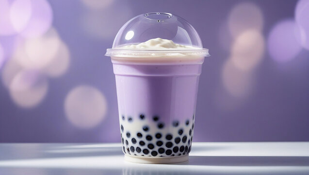 Creamy taro bubble tea with lavender purple gradient in clear plastic cup, tapioca pearls, and clean white background.