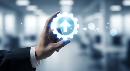 A hand interacts with a glowing futuristic gear displaying an upward pointing arrow