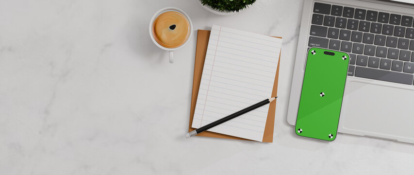 Flay lay, Top view office desk with green screen mobile phone, laptop, coffee, pencil, leaves with copy space marble background, with 3D rendering