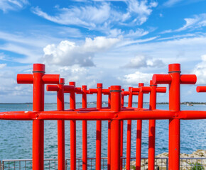 red wooden fence with blue sky