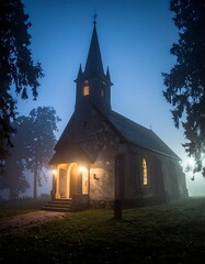 Spooky dusk view of a small church illuminated at twilight