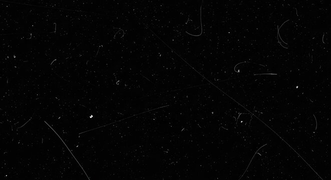 Vintage Film Overlay with Dust and Scratches on Black Background.