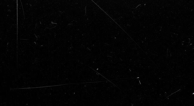 Abstract black background with subtle white scratches and dust particles.