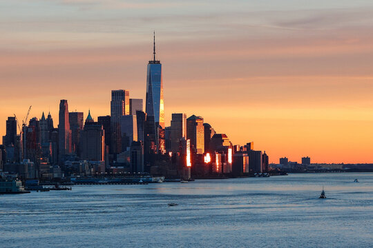 New York City Skyline at Sunset with One World Trade Center and Hudson River