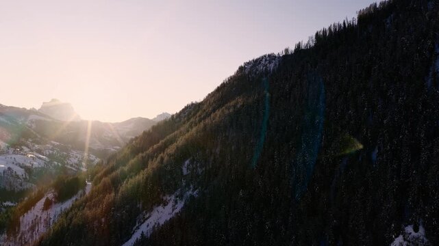 Sunlight Over Steep Mountains Over Arabba In The Dolomites Region Of Italy. Aerial Shot
