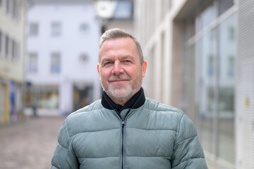 Naklejka premium Close up of a confident mature man urban portrait