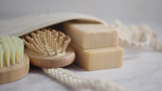 Natural soap and comb on a light background
