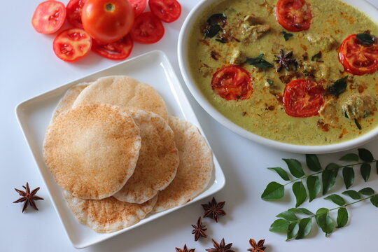 Kallappam, Kerala fermented rice pancakes made from rice batter fermented with yeast or toddy, served with chicken mappas in creamy coconut gravy. Authentic South Indian comfort food