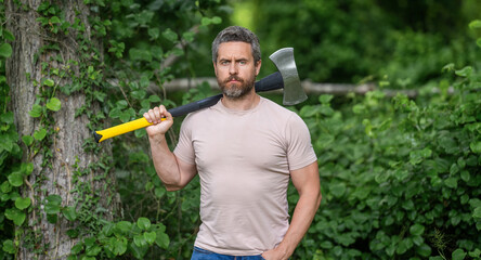 Brutality and masculinity. Mature lumberjack man with axe. Lumberjack axe. Man with logging axe. Hardworking brutal man. Lumberjack hardworking outdoor. Brutal strong lumberjack