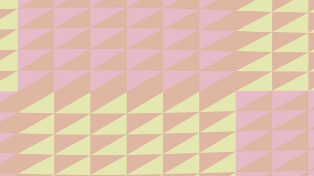 Geometric pattern of yellow, pink and orange triangles on a grid background