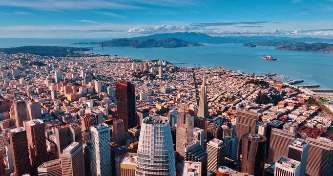 Flyover the highest Salesforce Tower in the stunning downtown San Francisco, California, US at daytime. Approaching the densely-built waterfront of the Bay.