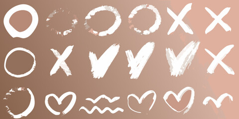 White chalk doodles of letters shapes and symbols on a brown surface