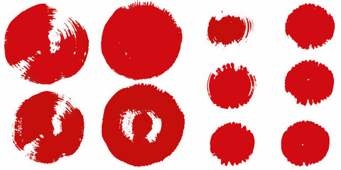 Abstract red brush strokes and circular shapes against a white background