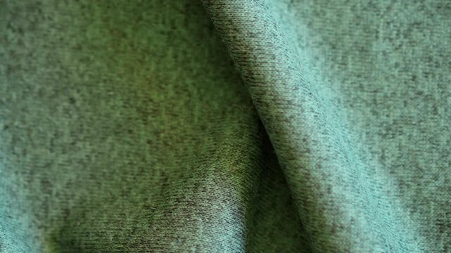 Fabric Texture Inspection. Tailor Examining Green Wool Material In Studio, seamless looping