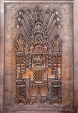 A carved wood representation of the Raimondi Stele (Estela Raimondi), a famous sacred artifact from the ancient Chav&iacute;n culture of Peru, at the Teleki castle in Posmus - Romania.