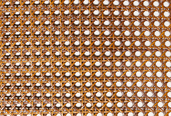 A detailed texture of natural woven rattan material, rattan wicker texture