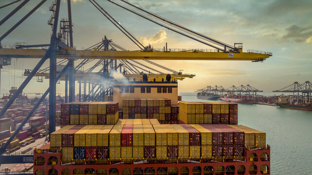 Aerial view Container cargo ship loading unloading container import export sea port, Global trade business container cargo ship freight shipping commercial trade logistic transportation international.