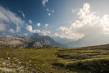 Sunset landscape of the Dolomites near Tre Cime with alpine meadows and dramatic peaks