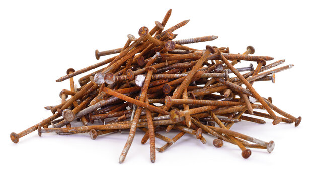 Pile of old rusty metal nails isolated on white background