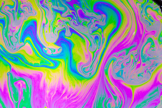 Psychedelic multicolored background abstract. Rainbow colors. patterns background. Photo macro shot of soap bubbles
