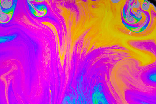 Psychedelic multicolored background abstract. Rainbow colors. patterns background. Photo macro shot of soap bubbles