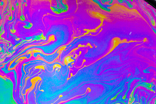 Psychedelic multicolored background abstract. Rainbow colors. patterns background. Photo macro shot of soap bubbles