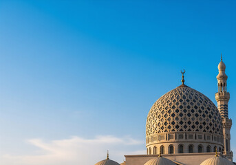 Majestic Grand Mosque Architecture with Dome and Minaret Against Clear Blue Sky