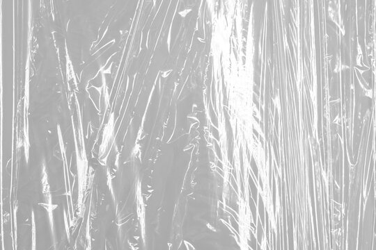 Transparent wrinkled plastic, white plastic or polyethylene bag texture, macro, no background