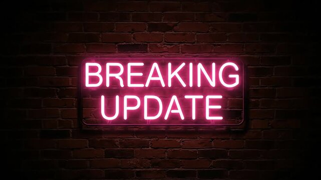 Neon breaking update sign on a brick wall announcement