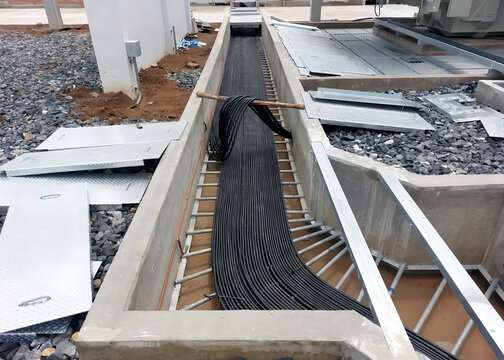 The control cables installation at the switchyard cable trench in the substation.