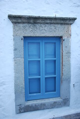 Fototapeta premium old window with shutters, Patmos island, Greece