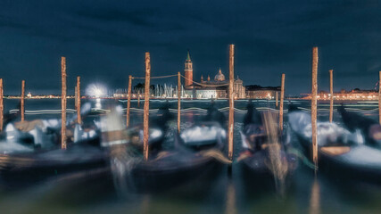 Venice gondolas swaying at night with san giorgio maggiore © Francesco 