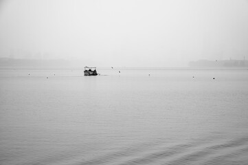 Minimalist Boat on Misty East Lake in Wuhan China