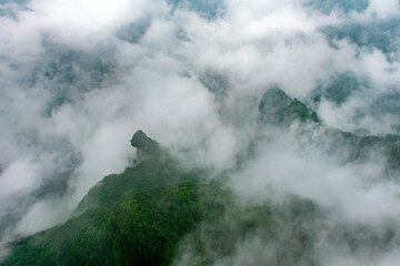 Misty Mountain Peaks Emerging Through Clouds at Tianmenshan China
