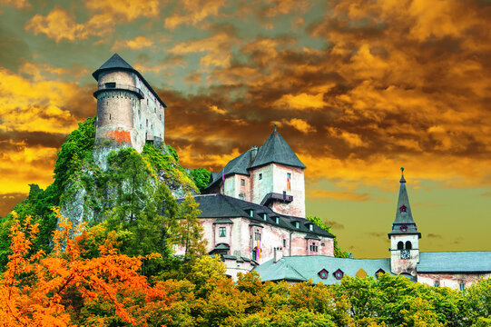 &bdquo;Orava Castle in Slovakia at night, famous filming location of the 1922 silent horror film Nosferatu. Dramatic gothic medieval castle on a rocky cliff with dark mysterious atmosphere.&ldquo;
