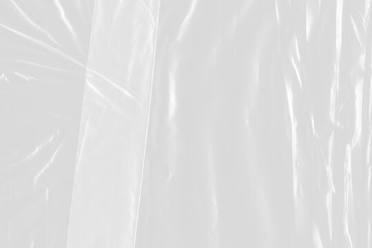 Clear plastic sheet with glossy light reflections isolated on a transparent background. a high-quality cutout overlay for creating realistic packaging effects or modern design textures.