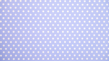 Blue and white polka dot pattern on fabric texture © Julia Jones