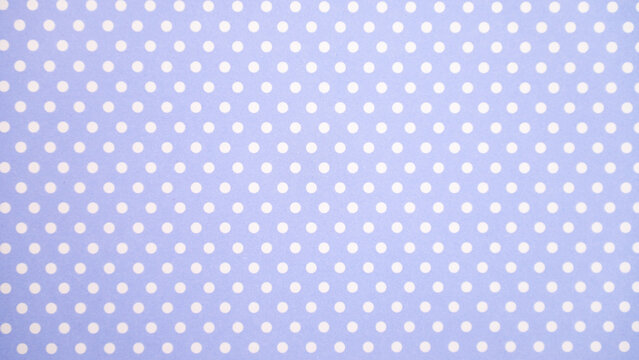 Blue and white polka dot pattern on fabric texture