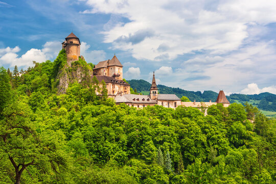 &bdquo;Orava Castle in Slovakia at night, famous filming location of the 1922 silent horror film Nosferatu. Dramatic gothic medieval castle on a rocky cliff with dark mysterious atmosphere.&ldquo;
