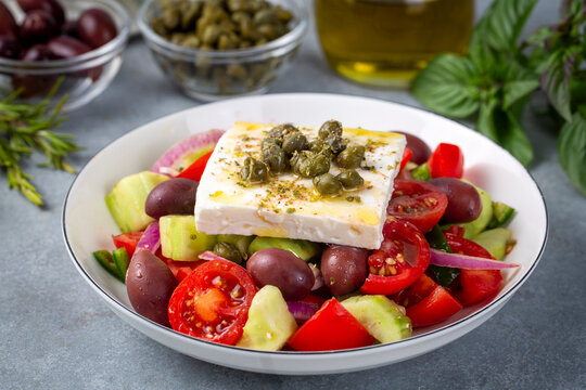 Greek salad with fresh vegetables, feta cheese and kalamata olives. Healthy food.