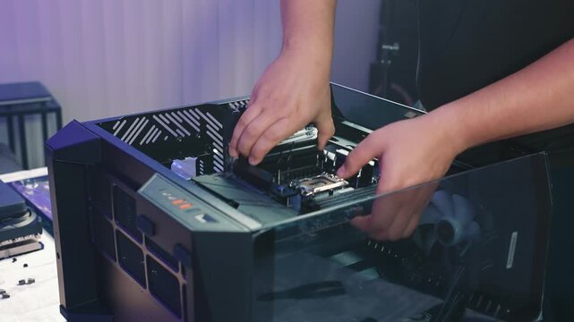 Removing motherboard with installed processor and cooling system from desktop computer case during disassembly or hardware replacement
