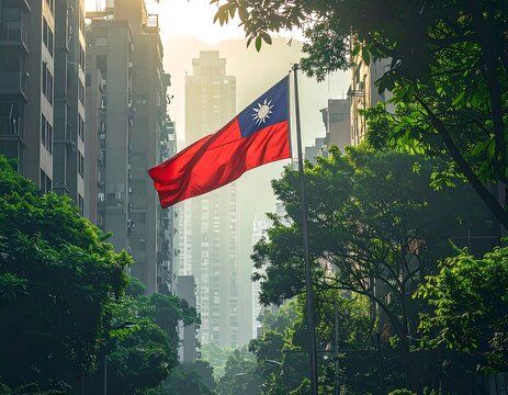 A Taiwanese flag waving in a city surrounded by trees