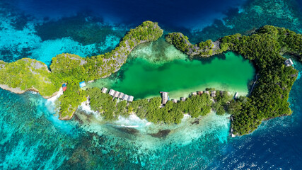 Aerial view with the green island with  turquoise hues of Raja Ampat © SASITHORN