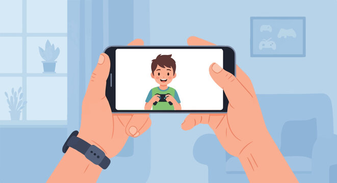 Person holding phone showing a smiling boy playing video game