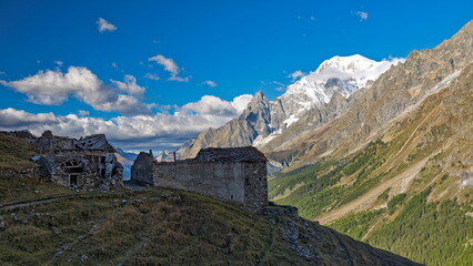 Val d'Aosta, Italy - August 15, 2025: Wide view of the Mont Blanc massif with jagged granite peaks and hanging glaciers above Val Veny.