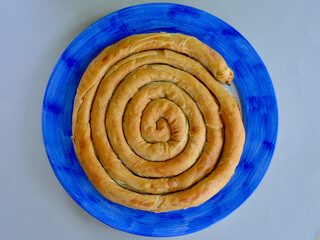 Spanakopita on a serving dish