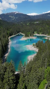 Caumasee Lake Cauma aerial drone turquoise lake in Flims, Switzerland vertical video