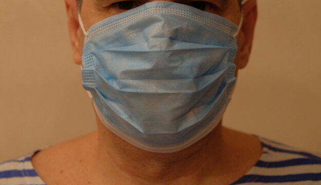 A person wearing a medical mask at a doctor's appointment